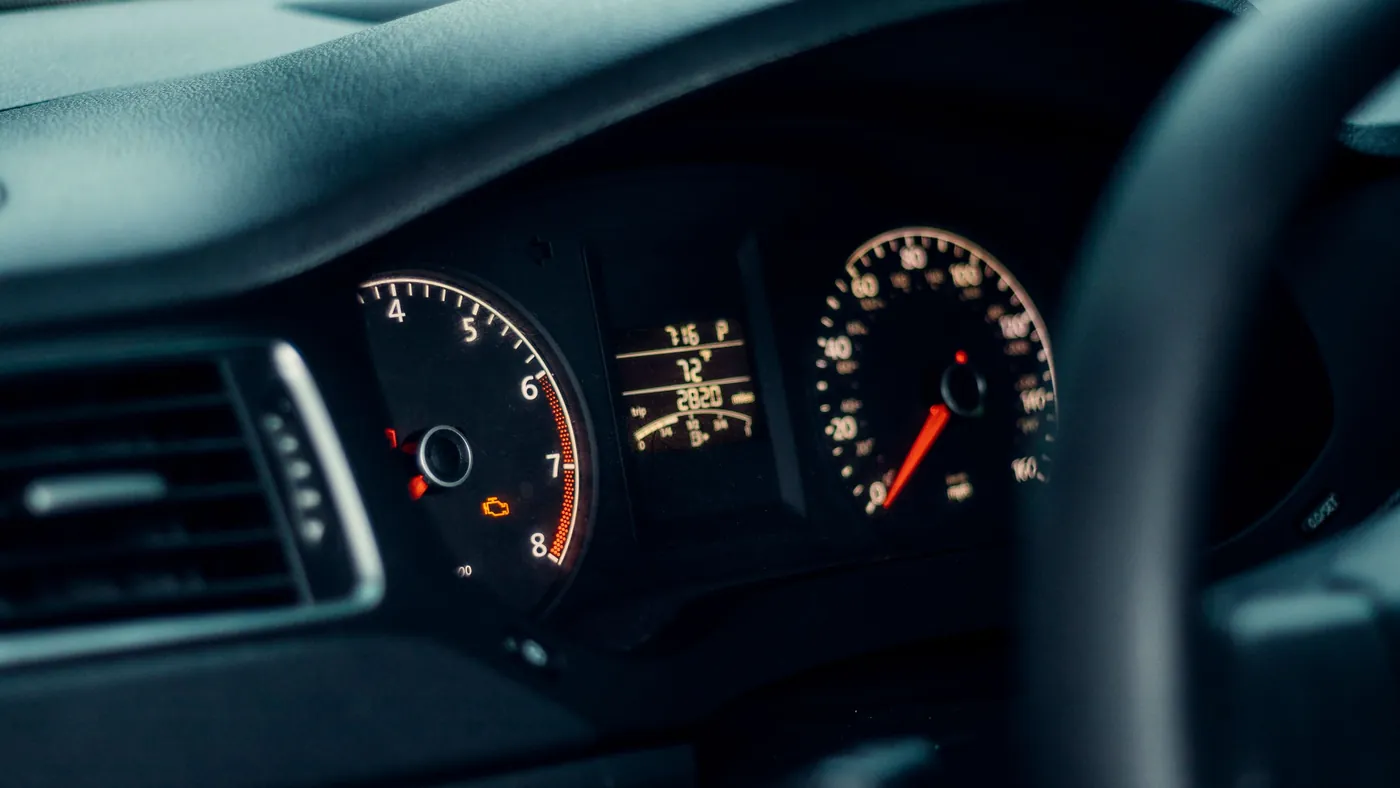 A car's illuminated gauges and speedometer glowing in low light, standing in for a readiness score that reads from zero to a top number you can't move by advertising harder.